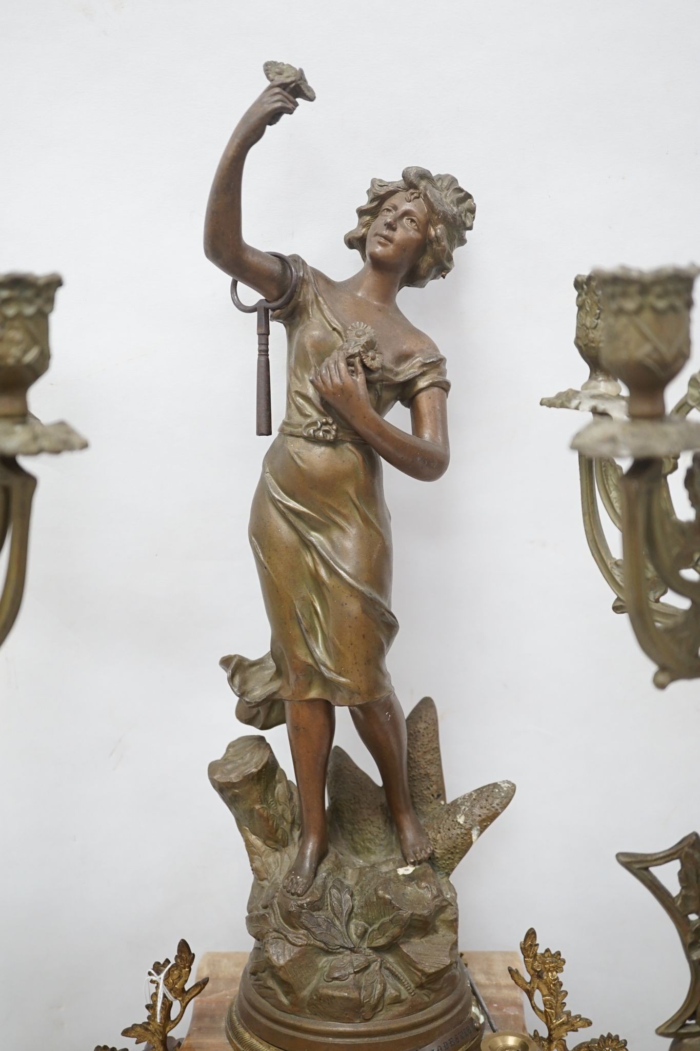 A French onyx and spelter figural clock garniture 66cm